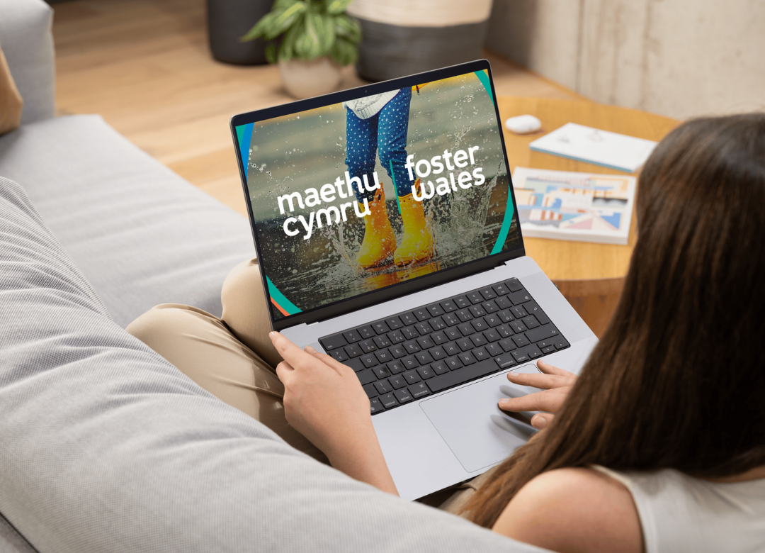 woman on laptop sitting on sofa